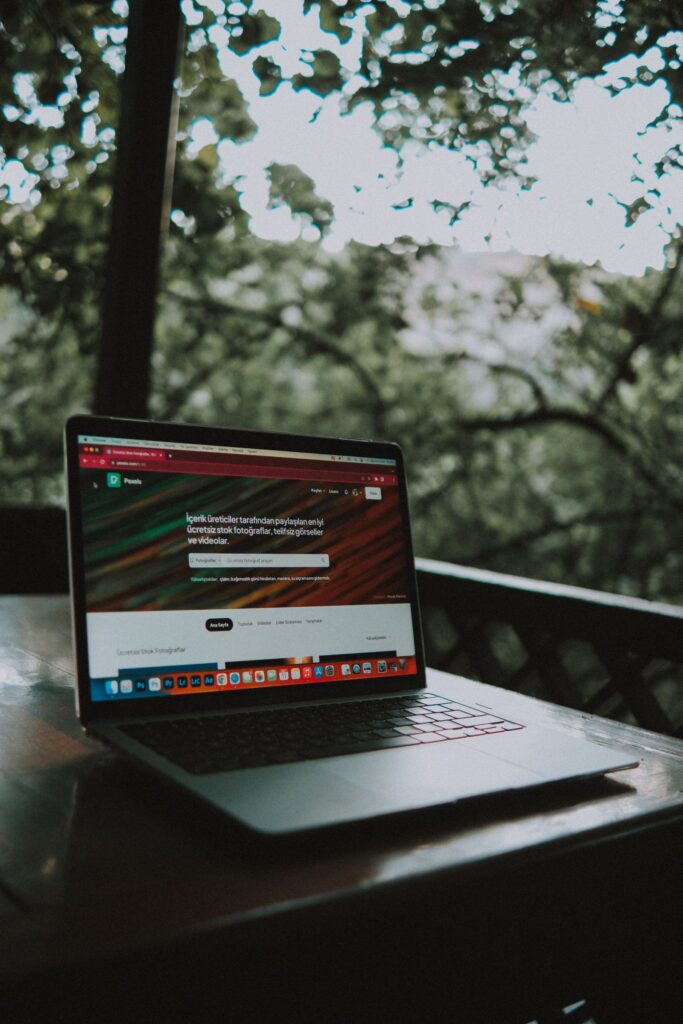 A corporate website open on a laptop, representing a domain and website build