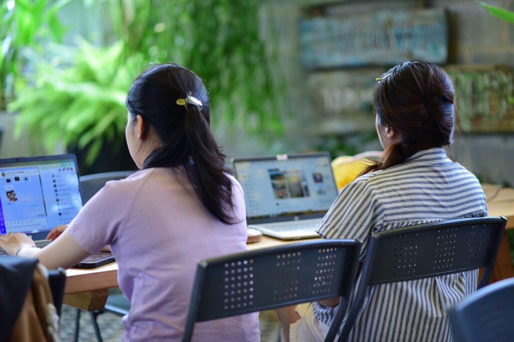 Team working together using shared cloud collaboration tools