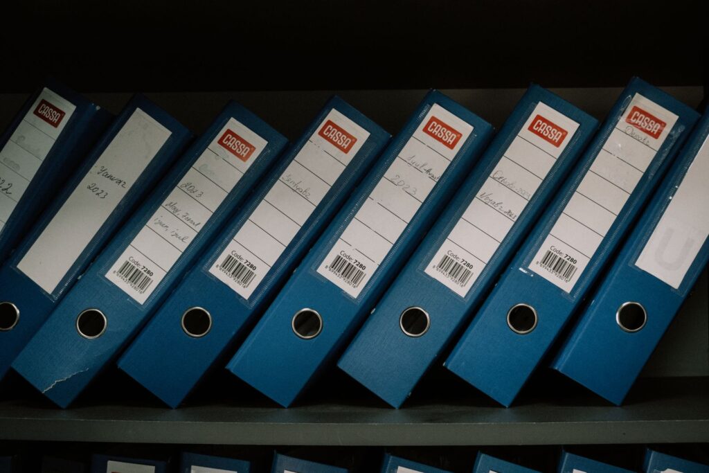 Organized, labeled financial records reflecting disciplined recurring bookkeeping
