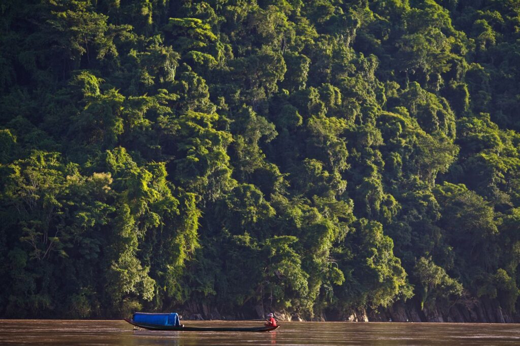 A boat on the Mekong River in Laos, reflecting the countrys geography and natural resource base for investors