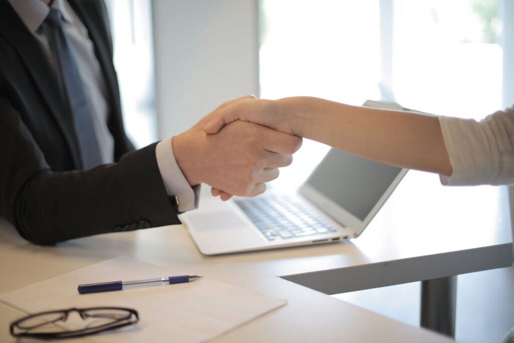 Employer welcoming a new hire, representing employer-of-record onboarding