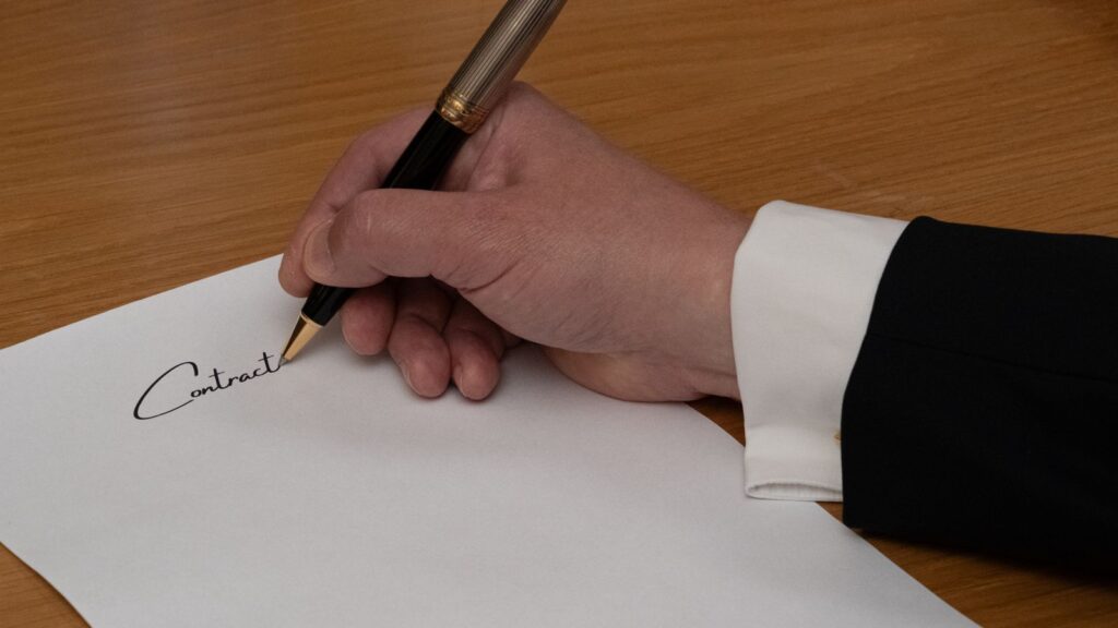 Signing a company ownership document, relevant to foreign ownership decisions in Laos