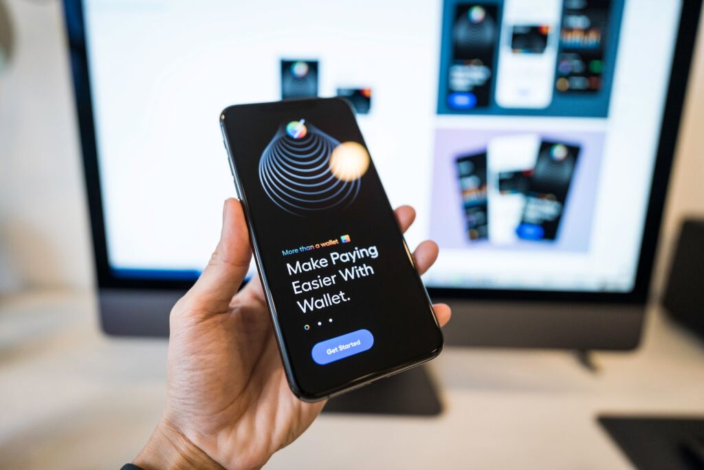 Digital wallet app on a smartphone, representative of managing funds while traveling