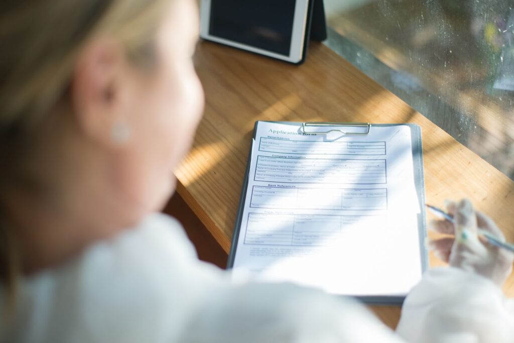 Completing a work permit or visa application form
